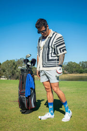 2 Putt golf socks being worn on the putting green