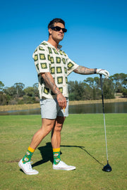Adult wearing colourful golf socks by Offbeat Socks