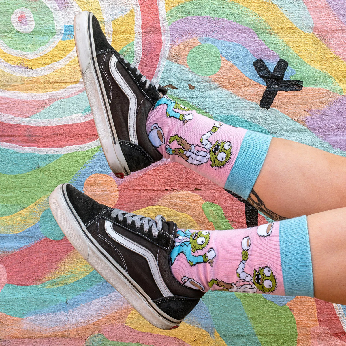 Close-up of coffee socks featuring The Drinking Dead zombie coffee design