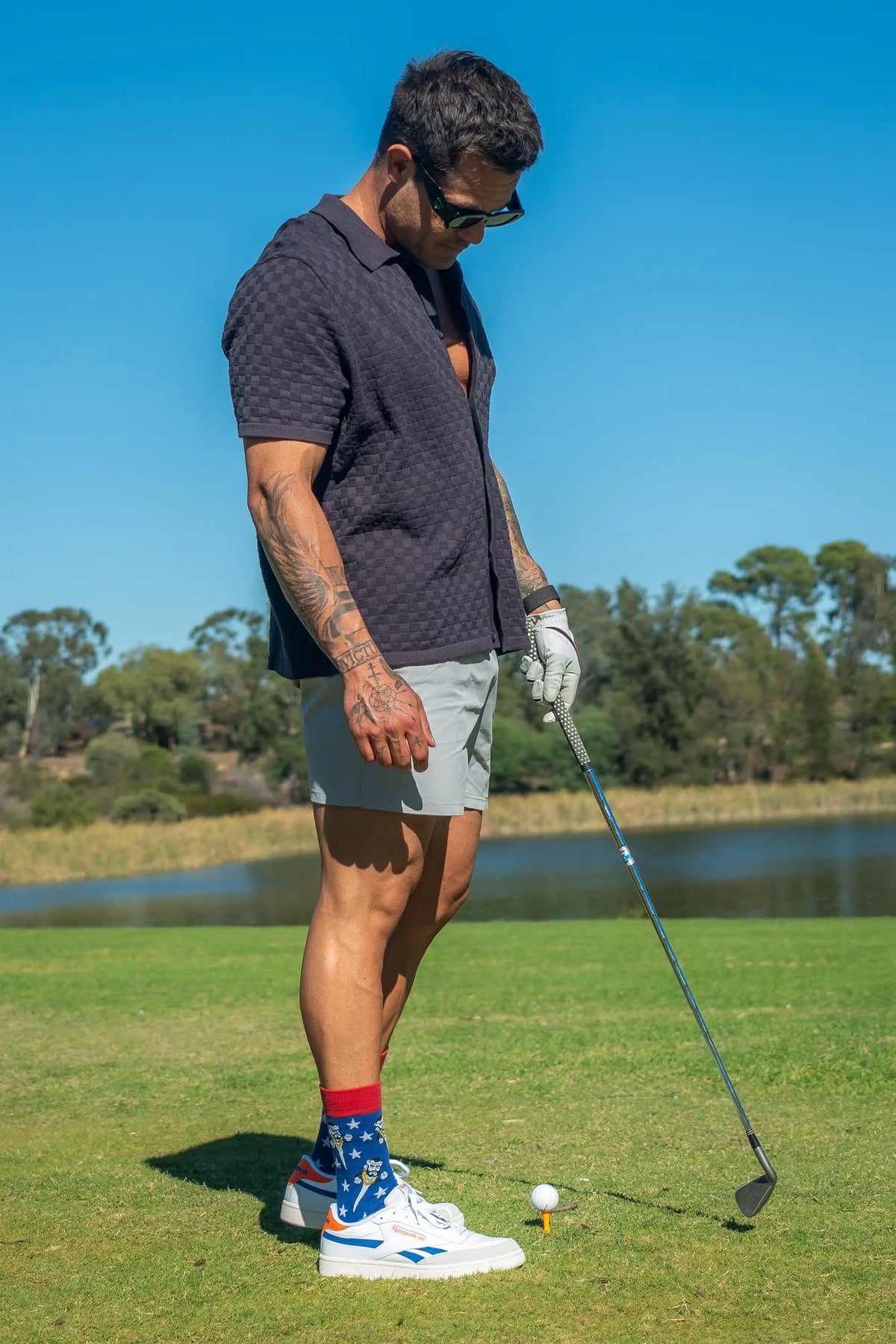 Adult wearing funny Mr Tee golf socks