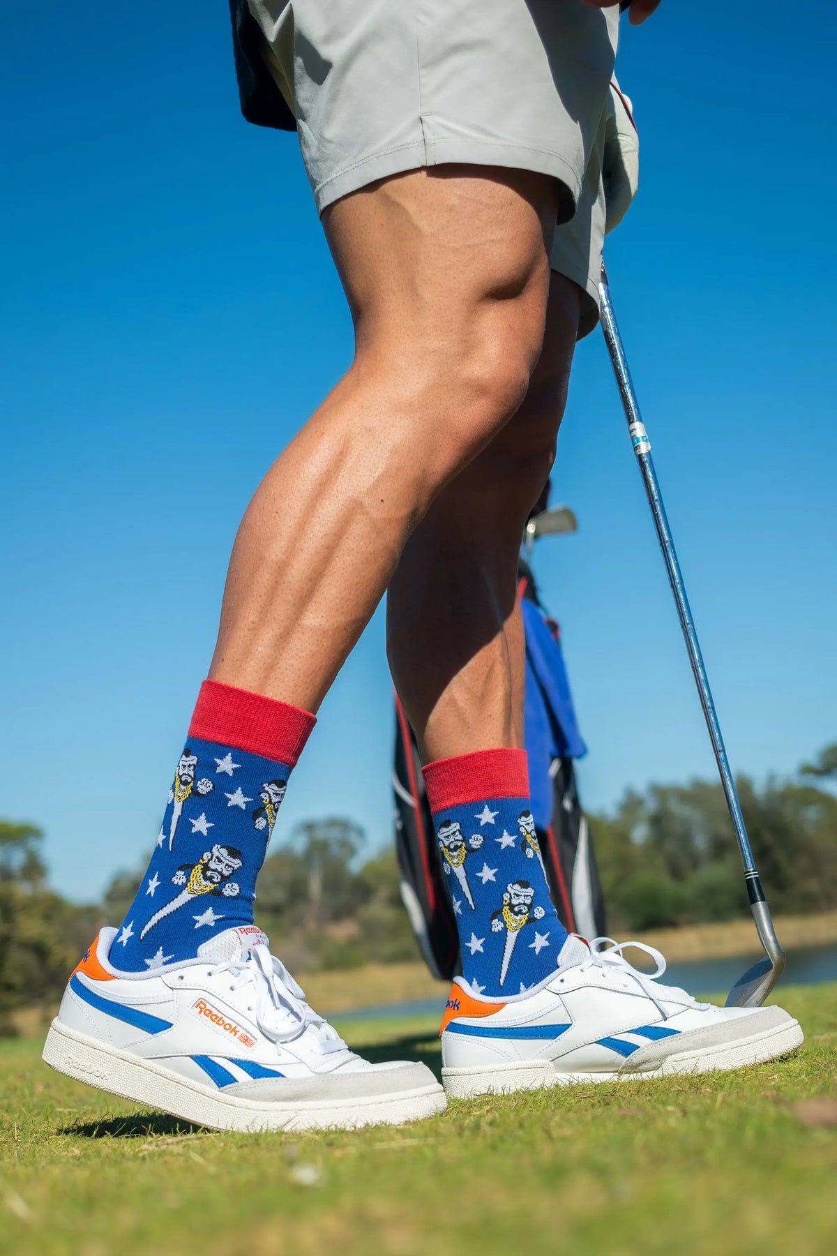Adult wearing colourful golf socks by Offbeat Socks