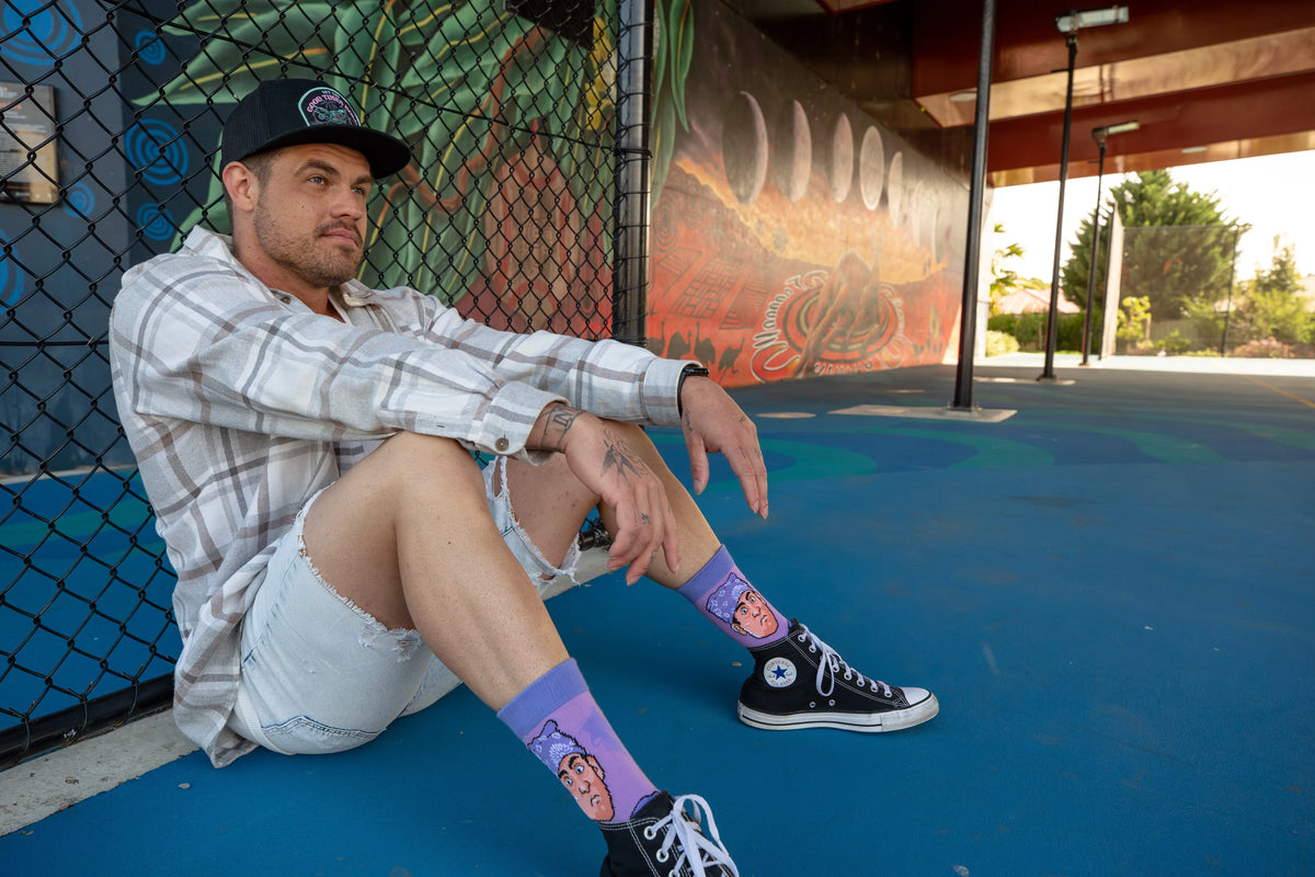 Adult wearing colourful Prison Mike socks