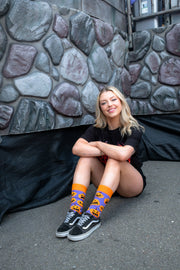 Adult wearing Sock O'Lantern Halloween socks