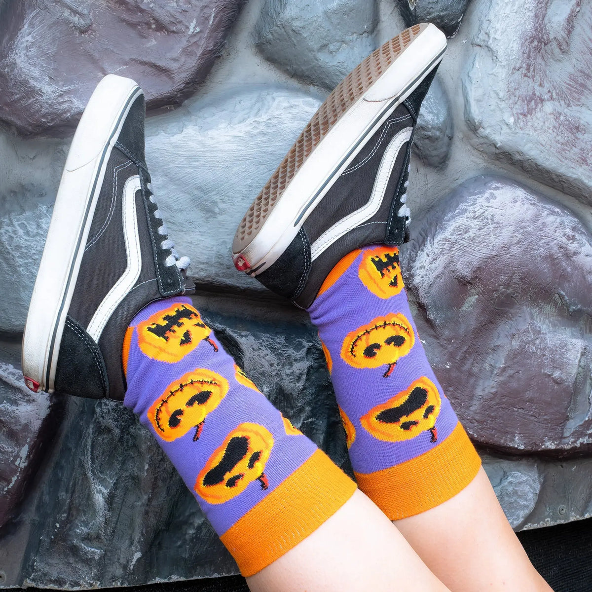 Close-up of Sock O'Lantern Halloween socks being worn