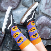 Close-up of Sock O'Lantern Halloween socks being worn